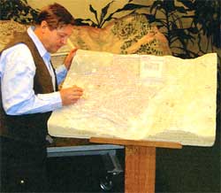 Picture of Ingemar working with one of the miniature models of Jerusalem
